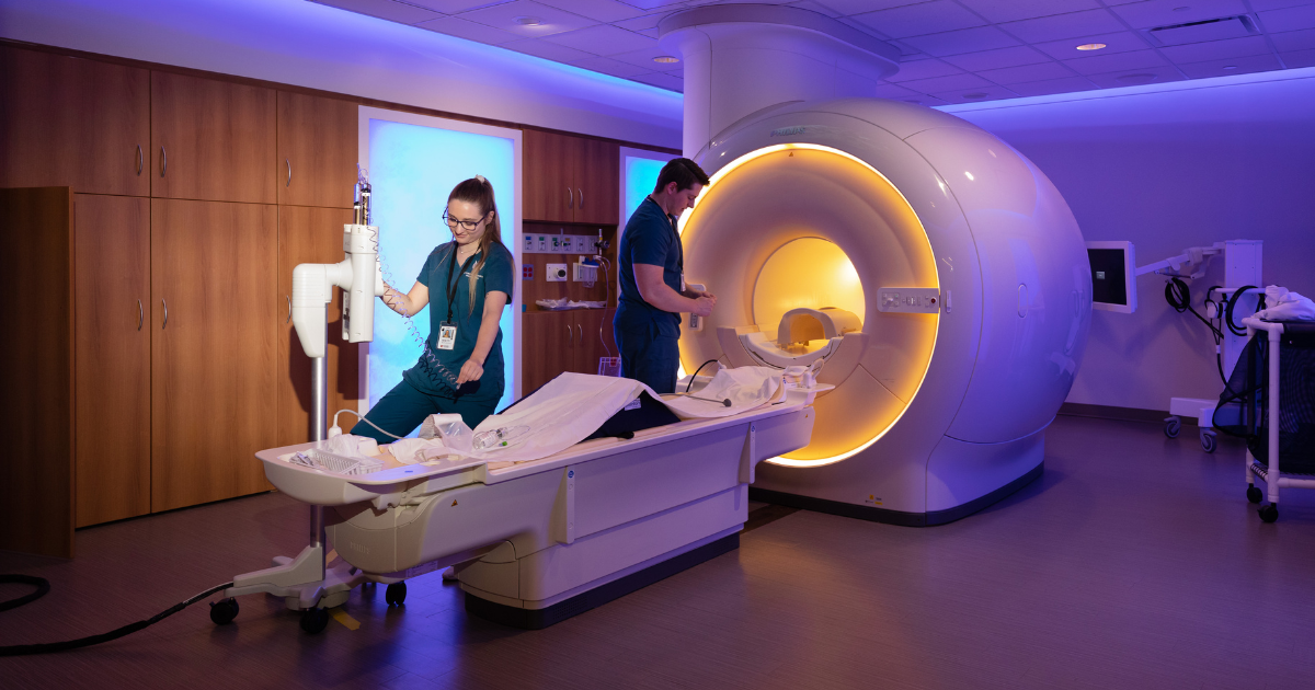 Two Nebraska Medicine providers preparing MRI machine