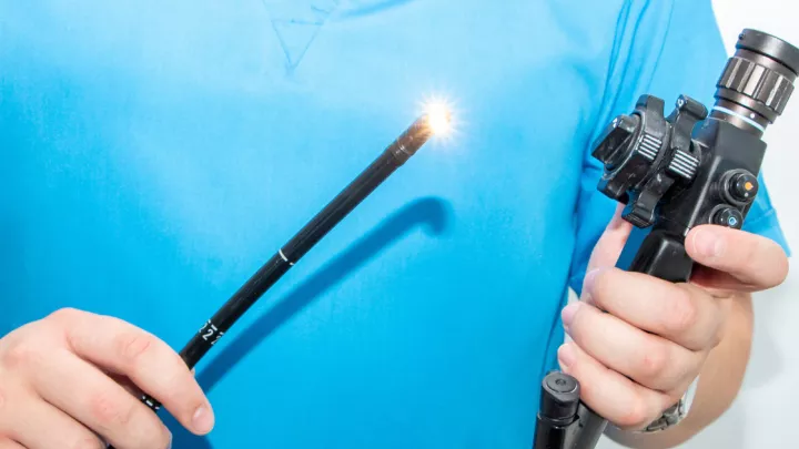 Doctor holding colonoscope